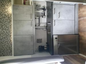 a kitchen with a large stainless steel refrigerator at Holiday Home Vrieschehuis Comfort Royaal by Interhome in Vlagtwedde +13 photos