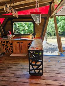 an inside view of a cabin with a table in it at Bungalow Ti Koko in Le Gosier