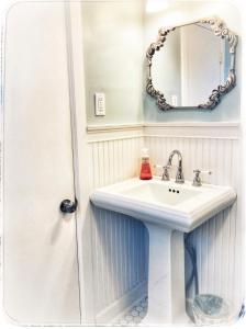 a bathroom with a white sink and a mirror at Truly Central Private Guest House in Nashville