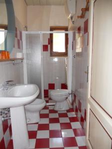 a bathroom with a sink and a toilet at Agriturismo Le Macine in Florence