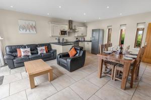 a living room with a couch and a table at Middleton Cottages in Yarm