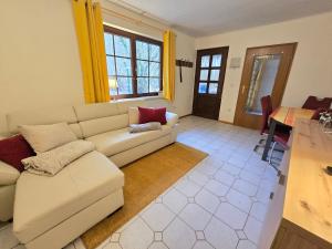 a living room with a couch and a table at Haus Seezeit in Plau am See