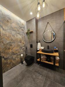 a bathroom with a black sink and a mirror at Elegant Visoko in Visoko +38 photos
