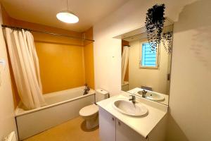 a bathroom with a sink and a toilet and a mirror at Les Naïades F27 - 1 bedroom for 4 people ! in Avène