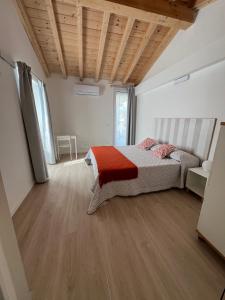Postel nebo postele na pokoji v ubytování Aranceto 10