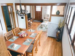 a dining room with a wooden table and chairs at 4BR 2BA Home in Charming St Paul - Sleeps 10 in Saint Paul