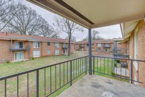 a balcony with a view of a brick building at Garden District Home Near Downtown Montgomery in Montgomery