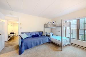 a bedroom with a bunk bed and a ladder at Mystic Sunrise in Lake Harmony +24 photos