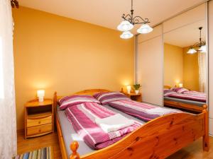 a bedroom with two beds and a large mirror at Apartment Andreas by Interhome in Balatonőszöd