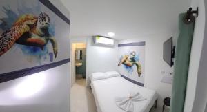 Postel nebo postele na pokoji v ubytování Hotel Dmauro + 9 fotografií