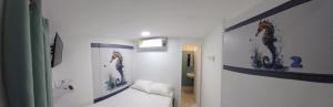 Postel nebo postele na pokoji v ubytování Hotel Dmauro