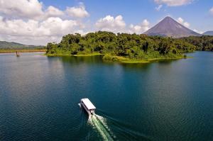 a boat on a lake with a mountain in the background at Studio 2327 in Pénjamo