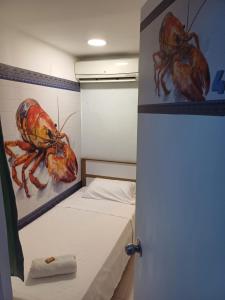 Postel nebo postele na pokoji v ubytování Hotel Dmauro