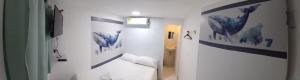 Postel nebo postele na pokoji v ubytování Hotel Dmauro