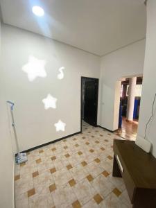 a room with white butterflies on the wall at Tanger City in Tangier