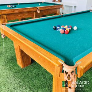 a pool table with pool balls on it at Palacio del Sur in Lurín