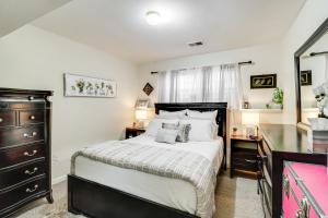 a bedroom with a large bed and a dresser at Cozy Centreville Apt Close to Historic Sites in Centreville