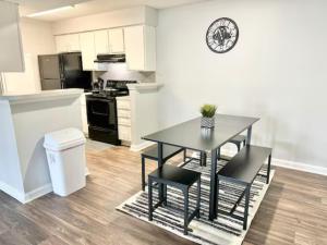a kitchen with a table and chairs in a room at Home Theater Sleeps 8 WiFi in Morrow