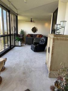 a living room with a couch and a table at Honolulu Minimum 30-Nite Rental 3 bed room 2 parking in Honolulu