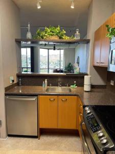 a kitchen with a sink and a window in it at Honolulu Minimum 30-Nite Rental 3 bed room 2 parking in Honolulu
