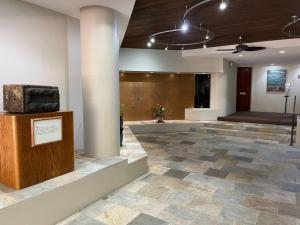 a lobby with a large room with a stone floor at Honolulu Minimum 30-Nite Rental 3 bed room 2 parking in Honolulu
