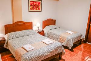 En eller flere senge i et værelse på Las Torrecitas