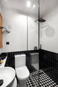 a bathroom with a toilet and a sink and a shower at Soho Athinas 60 in Athens