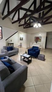 a large living room with couches and a table at Apartamento Maracuyá en Tarija in Tarija