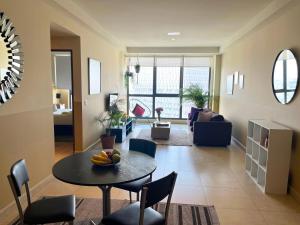 a living room with a table with a bowl of fruit on it at Begrand Alto Polanco Pool Gym Jacuzzi & More in Mexico City