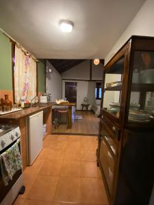 a kitchen with a counter and a dining room at Amanduarte Brasília in Brasilia