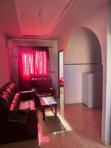 a living room with a couch and a table at Studio 7 en 3 eme étage in Oujda
