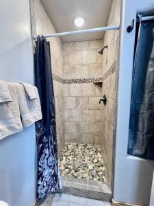 a bathroom with a shower with a shower curtain at Angel Rock Rentals of Moab Unit 10 in Moab