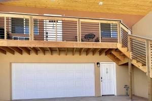 a house with a deck and a garage at Angel Rock Rentals of Moab Unit 10 in Moab