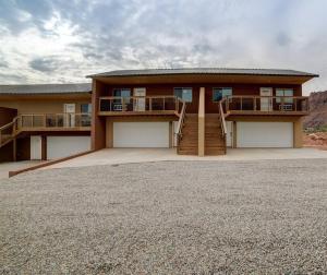 a large house with two decks and a balcony at Angel Rock Rentals of Moab Unit 11 in Moab