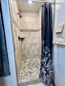a bathroom with a shower with a shower curtain at Angel Rock Rentals of Moab Unit 11 in Moab