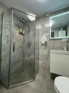 a bathroom with a shower and a toilet at PRZYSTANEK KATOWICE Aleja Korfantego 8 in Katowice +19 photos