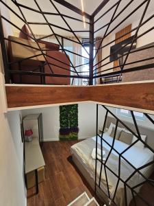 a room with a bunk bed and a spiral staircase at Lolo Luxury rooms & suites in Budva