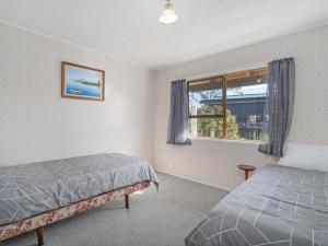 Postel nebo postele na pokoji v ubytování Golden Days - Whitianga Holiday Home