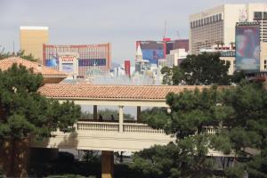 a bridge with a city in the background at LVStripHouse JC406 - Modern Superior Studio Condo - Sleeps 6 in Las Vegas
