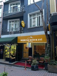 a blue building with a sign for akritas kompunta exit at Besiktas KonukEvi in Istanbul