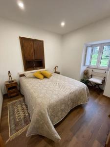 Ein Bett oder Betten in einem Zimmer der Unterkunft Casa da Bivó