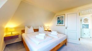 Ένα ή περισσότερα κρεβάτια σε δωμάτιο στο Friesen Hüs