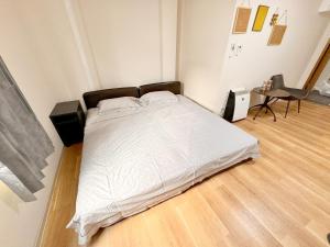Postel nebo postele na pokoji v ubytování 道頓堀House