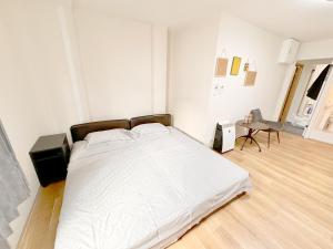 Postel nebo postele na pokoji v ubytování 道頓堀House