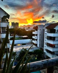 a sunset view of a city with buildings at Suite 5 Estrellas in Santa Cruz de la Sierra