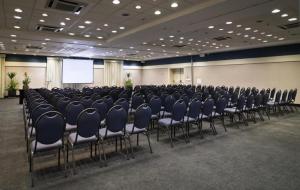 a conference room with a bunch of chairs in it at Flat de Luxo Aeroporto Congonhas - Hotel in Sao Paulo +158 photos