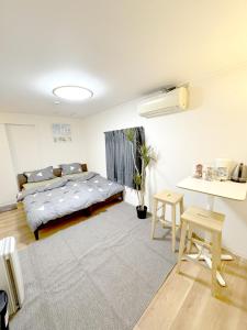 Postel nebo postele na pokoji v ubytování 道頓堀House