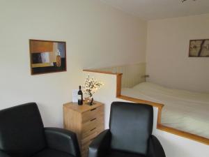 Säng eller sängar i ett rum på Appartementen Huize Eikenhof