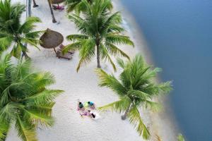 an overhead view of a beach with palm trees at The Origami: Exclusive Living ! in Long Bình
