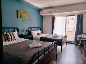 a hotel room with two beds and a window at Rest collection Gion-Shijo Kyoto in Kyoto +59 photos